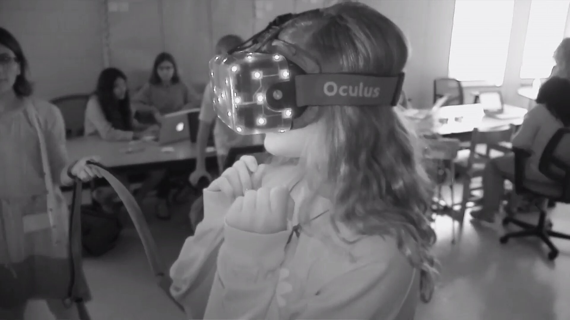 A student in a classroom trying out VR.